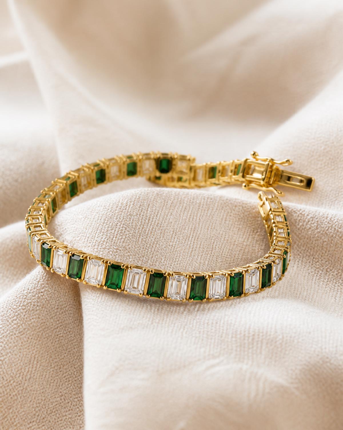 Emerald and diamond baguette line bracelet in 18k gold