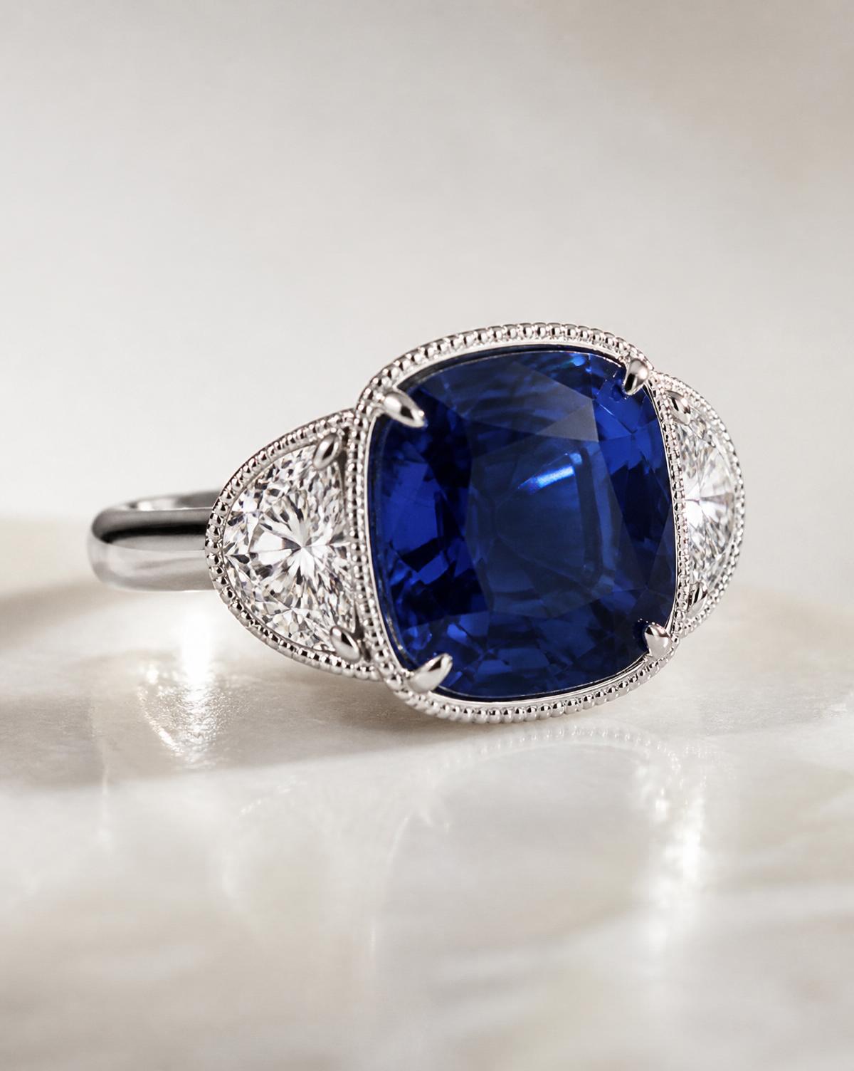 Cushion sapphire ring in platinum with half-moon diamonds