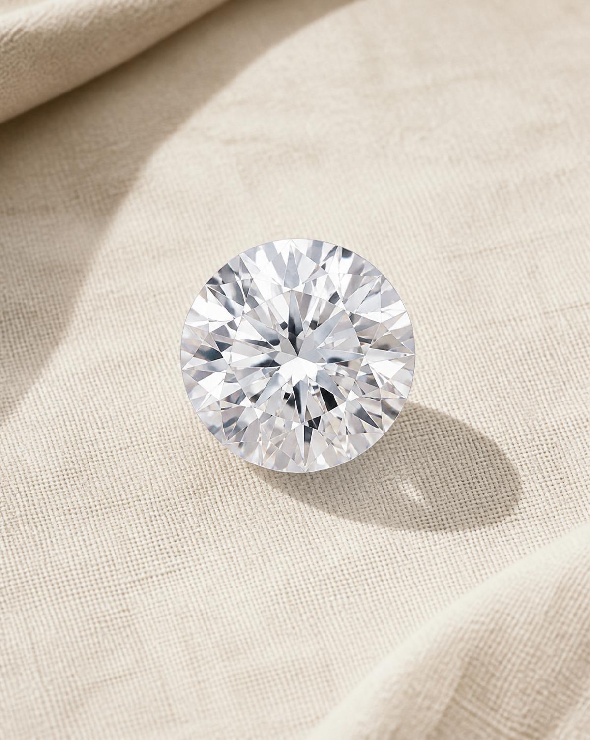 Investment-grade white round brilliant diamond on ivory linen